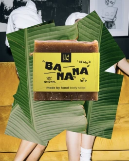 Hank Brussels Banana handmade body soap with bright yellow packaging, styled with banana leaves and lifestyle background.