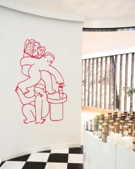 Large red line illustration created for the Buddy Buddy x Oatly pop-up, displayed prominently on a white wall inside the café.